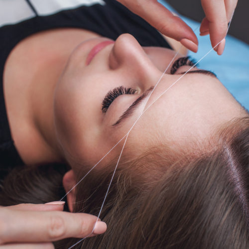 Completed facial threading treatment